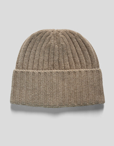 Beige knit beanie on a light gray background